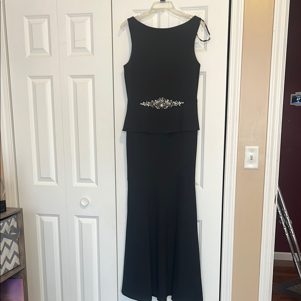 Elegant Black Sleeveless Dress with Embellished Waist